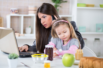 Overworked Businesswoman and her little daughter