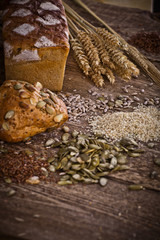 fresh bread and wheat on the wooden 