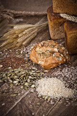 fresh bread and wheat on the wooden 