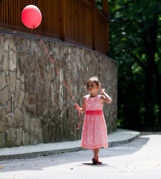 Little girl with balloon