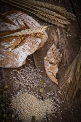 fresh bread and wheat on the wooden - rustic