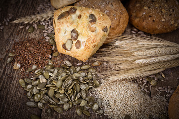 fresh bread and wheat on the wooden - rustic