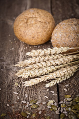 fresh bread and wheat on the wooden 