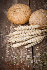 fresh bread and wheat on the wooden 