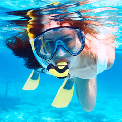 Woman with mask snorkeling