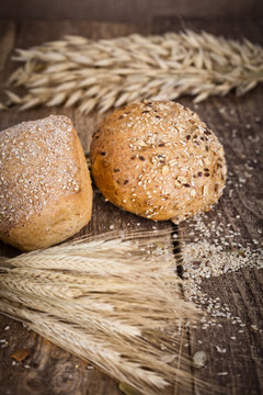 fresh bread and wheat on the wooden 