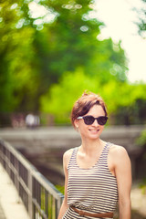 fashion portrait of a young sexy woman wearing sunglasses