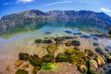 Sandy beach with sea and mountain