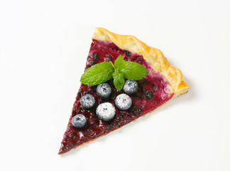 Slice of thin blueberry tart