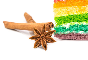Star anise with rainbow cake  isolated on white background