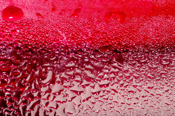 Abstract background of water drops on a red background