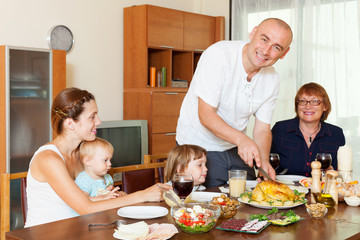 Obraz na płótnie Canvas happy family together over dining table
