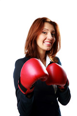  businesswoman wearing boxing gloves standing 