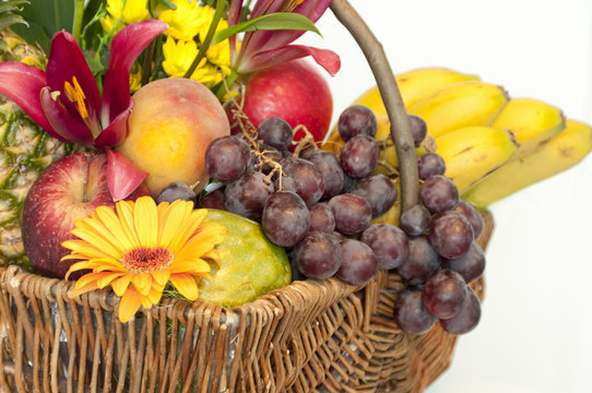 Basket full of fruits and flowers