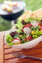 Veggie Healthy fresh vegetarian salad on a picnic table
