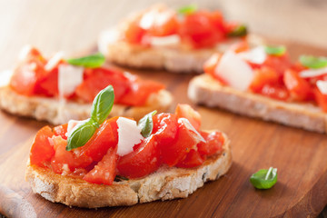 Italian bruschetta with tomatoes, parmesan, garlic and olive oil