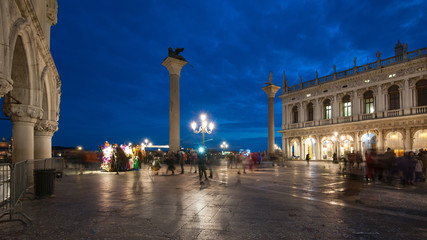 Fototapeta na wymiar Tourists in San Marco square during Carnival of Venice. Italy.