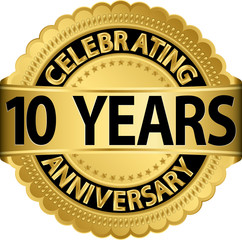 Celebrating 10 years anniversary golden label with ribbon, vecto