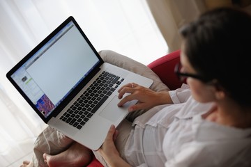 Fototapeta premium woman using a laptop computer at home