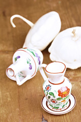 Small vases and decorative pumpkins on the table