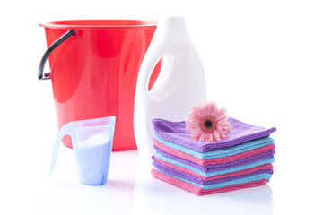 soft washing detergents with red bycket and fresh towels