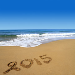 2015 written on sandy beach