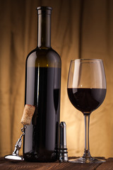 corkscrew glass  and wine bottle