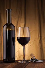 corkscrew glass and wine bottle