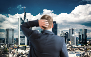 Businessman looking at skyline
