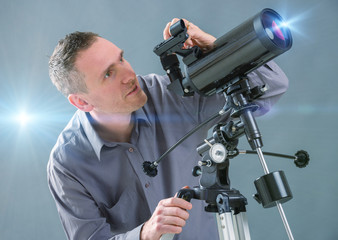 Man looking through telescope