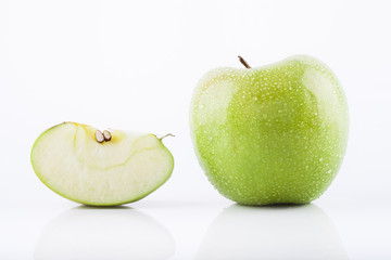 Green Granny Smith apple with waterdrops