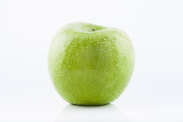 Green Granny Smith apple with waterdrops