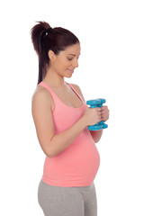 Pregnant woman doing exercise with dumbbells