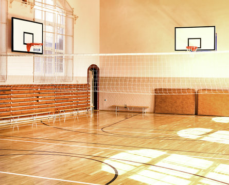 Empty School gym with basketball boards