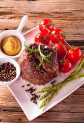 Grilled steaks on wood 