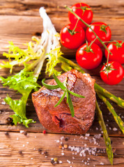 Grilled steaks on wood 