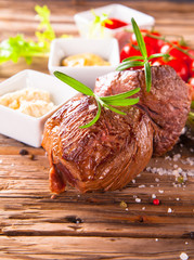 Grilled steaks on wood 