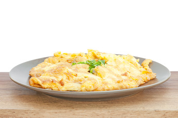 closeup of omelette, typical rolled plain omelette on a white ba
