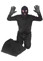 bandit with sack surrendering over white