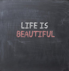 Life is beautiful text on a blackboard