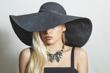 Beautiful Blond Woman in Black Hat.Spring.Accessories.Jewelry