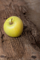 Apple on wooden board