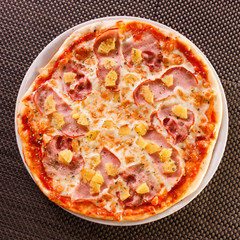 Pizza with pineapple and ham