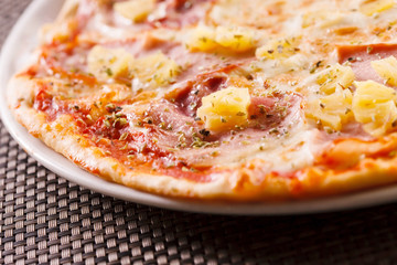 Pizza with pineapple and ham
