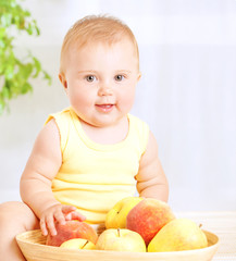 Cute baby with fruits