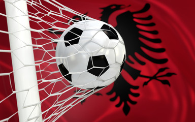 Flag of Albania and soccer ball in goal net