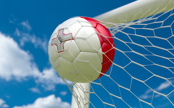 Flag of Malta and soccer ball in goal net