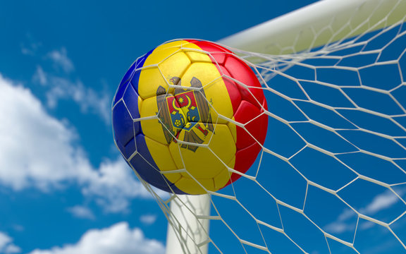 Flag of Moldova and soccer ball in goal net