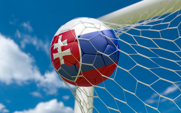 Flag of Slovakia and soccer ball in goal net