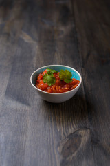 Salsa sauce on wood table